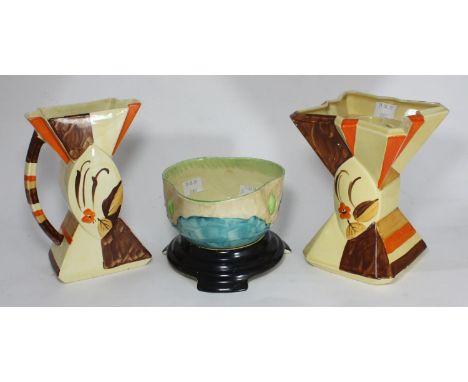 Three assorted Myott. Son &amp; Co Art Deco pottery items comprising a bow tie vase decorated in a cream, orange and brown fl