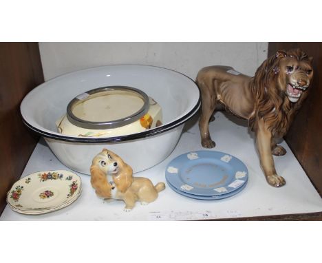 SECTION 16.  Three large white enamel bowls with black rims, together with a large Italian pottery figure of a male lion, a R