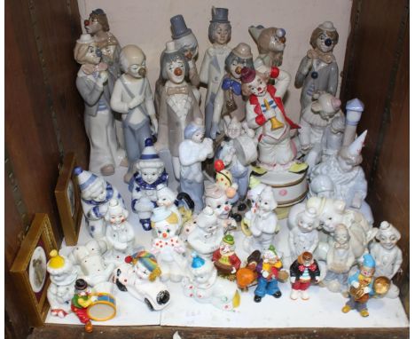 SECTION 24.  A large quantity of porcelain clowns including Casades figurines, a musical clown, various clowns playing musica