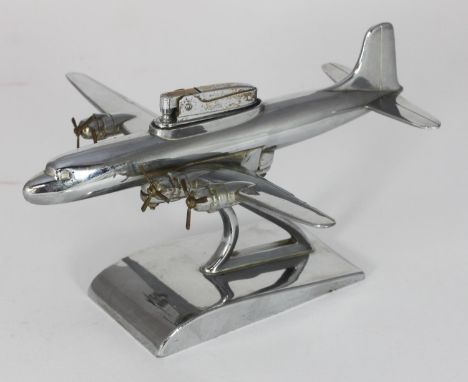 A 1950s/60s Sarome novelty table lighter modelled as a four-prop engine passenger plane, 21cm long 