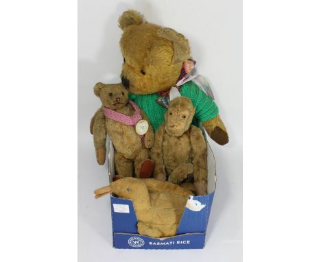 An early Steiff 'style' teddy bear, with straw stuffing and internal leather bellow movement, together with another Steiff 's