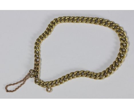 An early 20th century 18ct gold curb-link bracelet with sliding spring catch and safety chain, 19.0g 