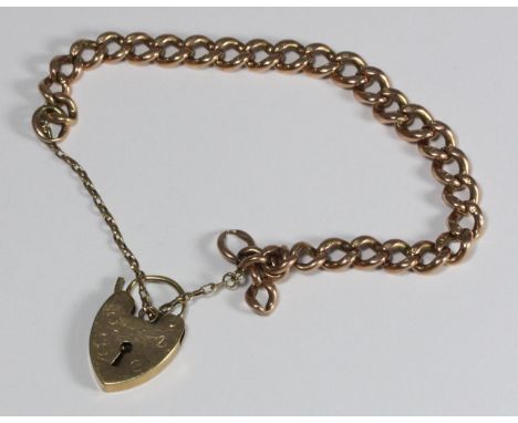 A 9ct gold Albert chain bracelet with 9ct gold love heart pendant, gross weight approximately 21.1g 