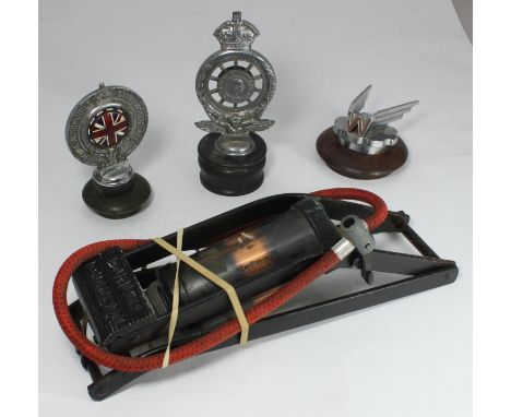 A chromium plated Wolseley car mascot with enamelled red 'W', mounted to turned wooden base and two royal automobile club ass
