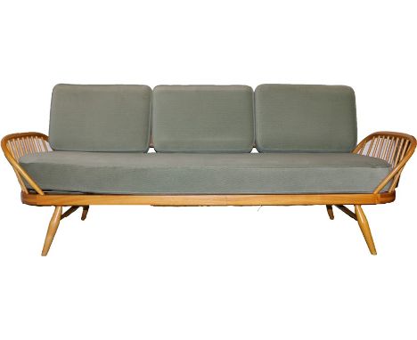 Ercol elm day bed/studio sofa, with removable back, pierced railed ends, three loose cushions and seat cushion, on turned tap