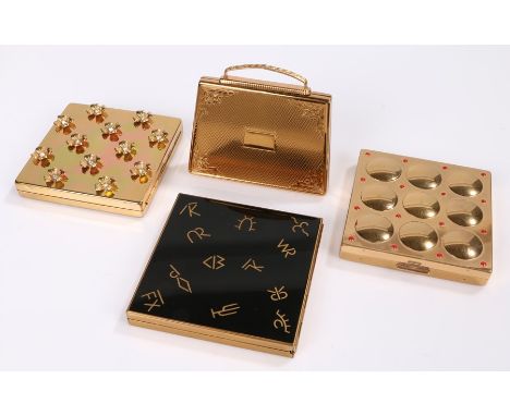 Four vintage powder compacts; a 1940s 'Paul Flato' gold tone powder compact encrusted with rhinestone dogwood blossoms in ori
