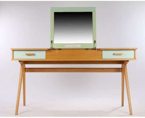 20th Century light oak desk/dressing table, with central hinged compartment lifting to reveal a mirror, with two frieze drawe