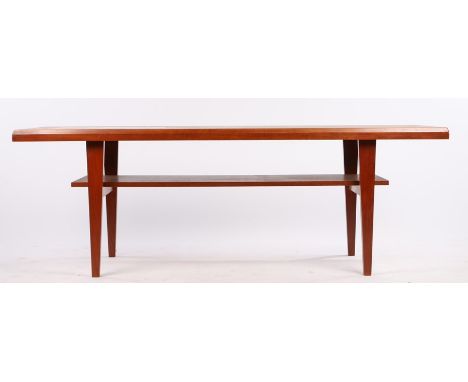 1970's teak coffee table, the top inset with four Celtic style tiles, on tapering legs united by a flattened undertier, 149cm