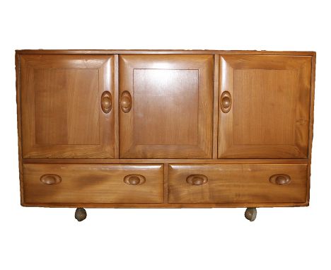 Ercol elm sideboard, with three cupboard doors above two drawers, the right hand cupboard with interior cutlery drawer, raise