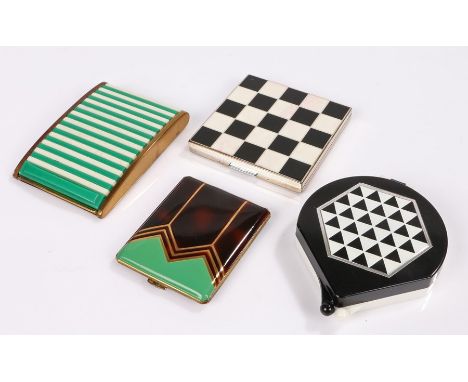 Four vintage powder compacts; a 'Datsun' compact in a black &amp; white chequered pattern' an unusual German 'shutter top' co