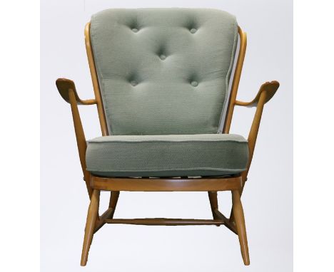 Ercol elm armchair, with fitted button back cushion and seat cushion, curved arms on turned supports, on turned tapering legs