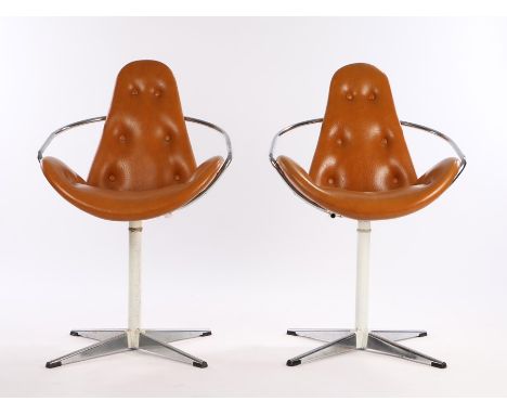Pair of mid 20th Century swivel chairs, with brown leather button upholstered backs and seats, chrome arms, on white painted 