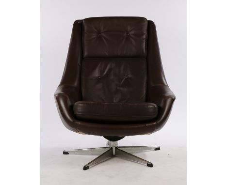 1970's brown leatherette upholstered swivel chair, with button back and seat, on a chrome base