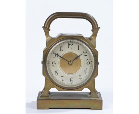 French brass mantel clock, with pierced handle above a compass, the silvered dial with Arabic numerals, on shaped feet and a 