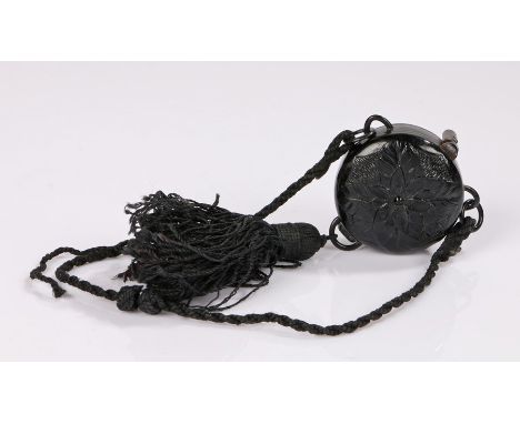 1920s black Bakelite powder compact with a cord handle and decorative tassel with a lipstick holder concealed inside (1). 