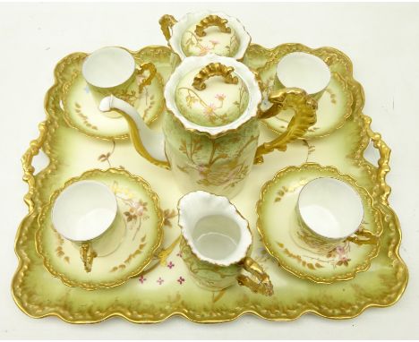 Early 20th Century cabaret set comprising, oblong two handle tray, teapot, sucrier, cream jug and four cups and saucers, each