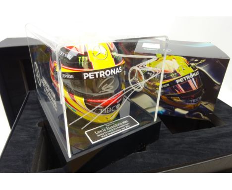 Lewis Hamilton signed 1:2 scale 2017 helmet, on LED light up display stand with clear cover, engraved with Mercedes emblem, p