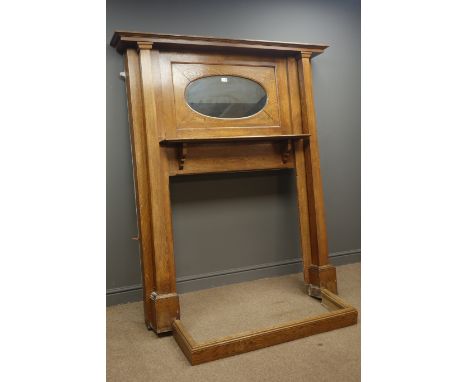 Arts & Craft period oak fire surround, projecting cornice, inset oval mirror, above shelf, square columns pilasters, and fend