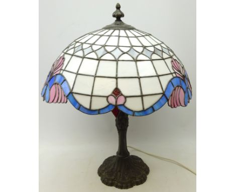 Tiffany style table lamp with leaded glass shade and moulded cast metal base, H68cm  Condition Report Click here for further 