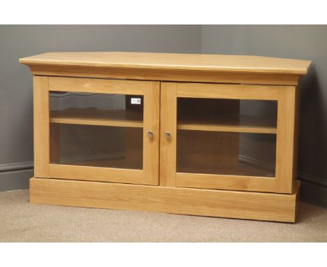 Oak finish television stand, two glazed doors enclosing one shelf, plinth base, W115cm, H61cm, D53cm Condition Report Click h