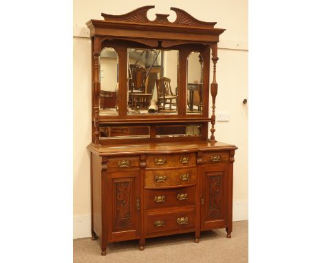 Edwardian walnut sideboard, shaped and carved pediment, two turned and fluted columns, three piece bevel edged mirror back, o