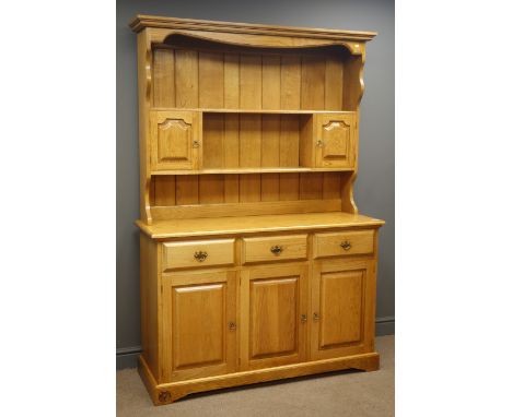 Royal Oak Furniture 'Yorkshire Rose' oak dresser, two shelves with plate rack, two cupboards, three drawers and three cupboar