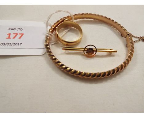 An 18ct gold buckle ring, 9ct gold flower bar brooch and a 9ct rope twist design bangle     Ring approx 6.3g, brooch & bangle