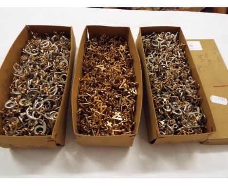 Three boxes of military or police brass cap/epaulette numbers
