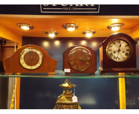 A 19thC mahogany cased mantel clock with silvered dial and Roman numerals, the brass movement stamped with crown and anchor a