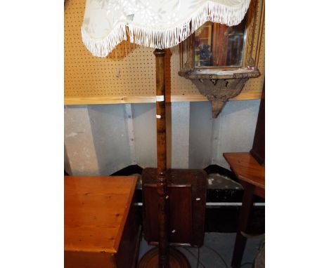 A turned wood lamp stand and two wooden trays
