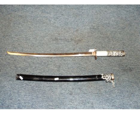 A 20thC Japanese katana with painted metal scabbard, faux ivory handle and dragon decorated tsuba