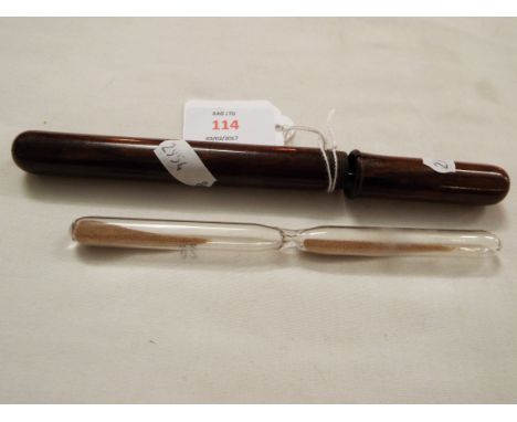 An unusual long 20 second glass sand timer in a fitted wooden tube