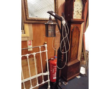 A vintage stained oak lamp stand with adjustable stand and lantern 