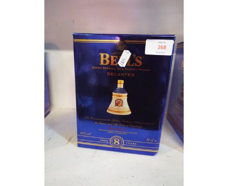 A boxed Wade decanter of Bells whisky 'To Commemorate the Golden Wedding Anniversary of the Queen and The Duke of Edinburgh'
