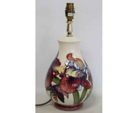 Moorcroft "Frilled Orchid" pattern baluster table lamp base with cream ground. 36cm high including bulb holder. No shade. 