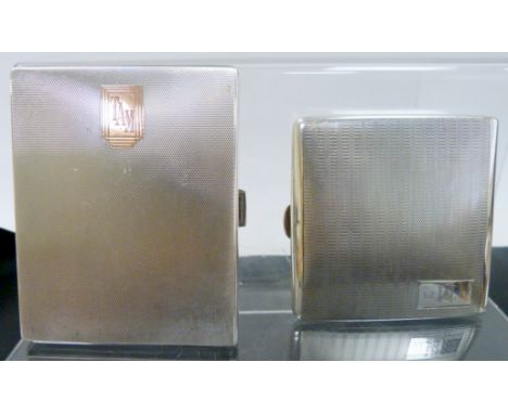 Two silver cigarette cases, engine turned, 298g.&nbsp; 