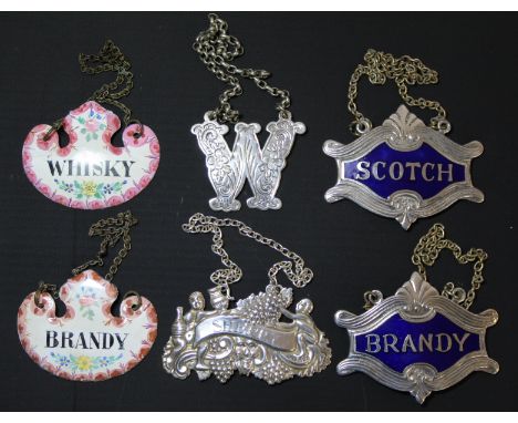 Two small Staffordshire style enamel cartouche spirit labels "Brandy" and "Whisky", another two ep enamelled for "Scotch" and