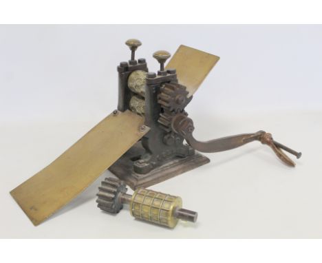 Victorian cast iron and brass sweet drop rolling machine by L. Collier, Rochdale, no.2, with one additional roller.