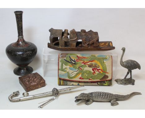 Small collection of Eastern and Oriental items, comprising: carved bamboo Chinese river boat or sampan; white metal figure of