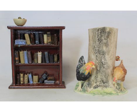 Cumbrian studio pottery ceramic sculpture of a bookcase by Rawson, 21cm high, impressed no. RP0086, with paper label; also a 