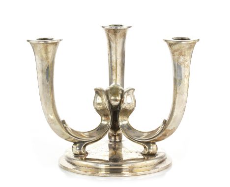 A VINTAGE SILVER PLATED CANDELABRA, WMF designed as three tapering stems joined in the centre atop a circular base, 19cm.