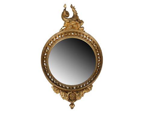 A GOOD SIZE REGENCY CIRCULAR GILT CONVEX MIRROR. the circular convex plate within a reeded ebonised slip and sphere applied i