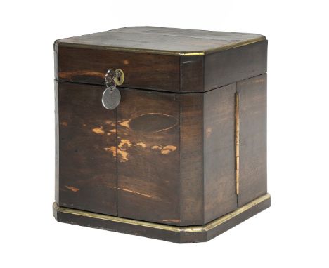 A 19TH CENTURY COROMANDEL TWO DOOR DECANTER BOX. The top having a brass banded edge above a pair of doors to the front openin