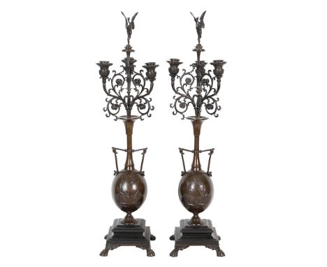 A PAIR OF FRENCH BRONZE CANDELABRA BY HENRY CAHIEUX &amp; FERDINAND BARBEDIENNE. A pair of French patinated bronze candelabra