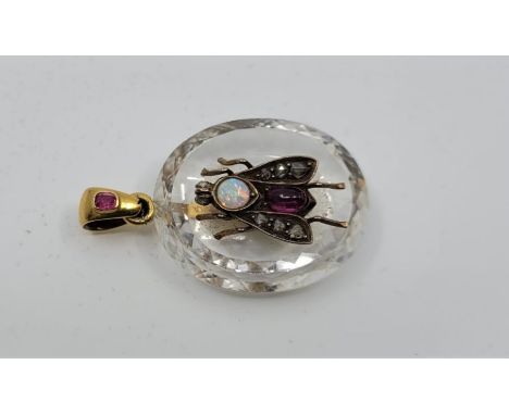 A late 19th century rock crystal "insect" pendant,&nbsp;the faceted oval rock crystal pendant with concave face and applied y