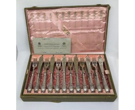 A fine quality cased silver plated fish knife and fork set for twelve, complete in fitted pink silk lined case. Condition not