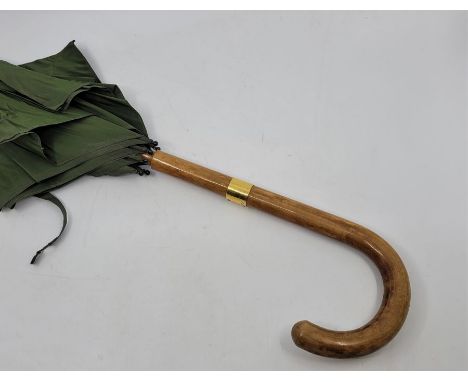 A vintage Brigg (London) umbrella, having burr wood handle with yellow metal mount stamped "Brigg, London", bamboo shaft, gre