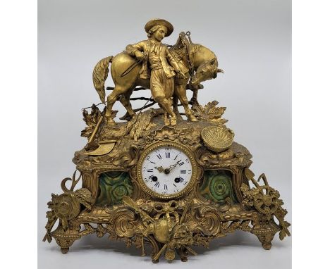 A French late 19th century gilt metal mantle clock, the movement by Henry Marc, having white enamel dial with blue Roman nume