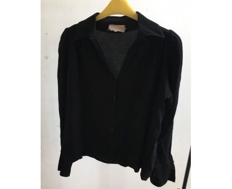 An Ossie Clark black blouseCondition note: Size 6-8 estimated, tear to one cuff where button attached, button lacking, extra 