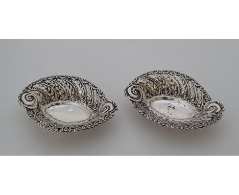 A pair of Victorian pierced silver bon bon dishes, by Walker &amp; Hall, Birmingham 1900, length 13.5cm. (80.7g). (2)&nbsp;